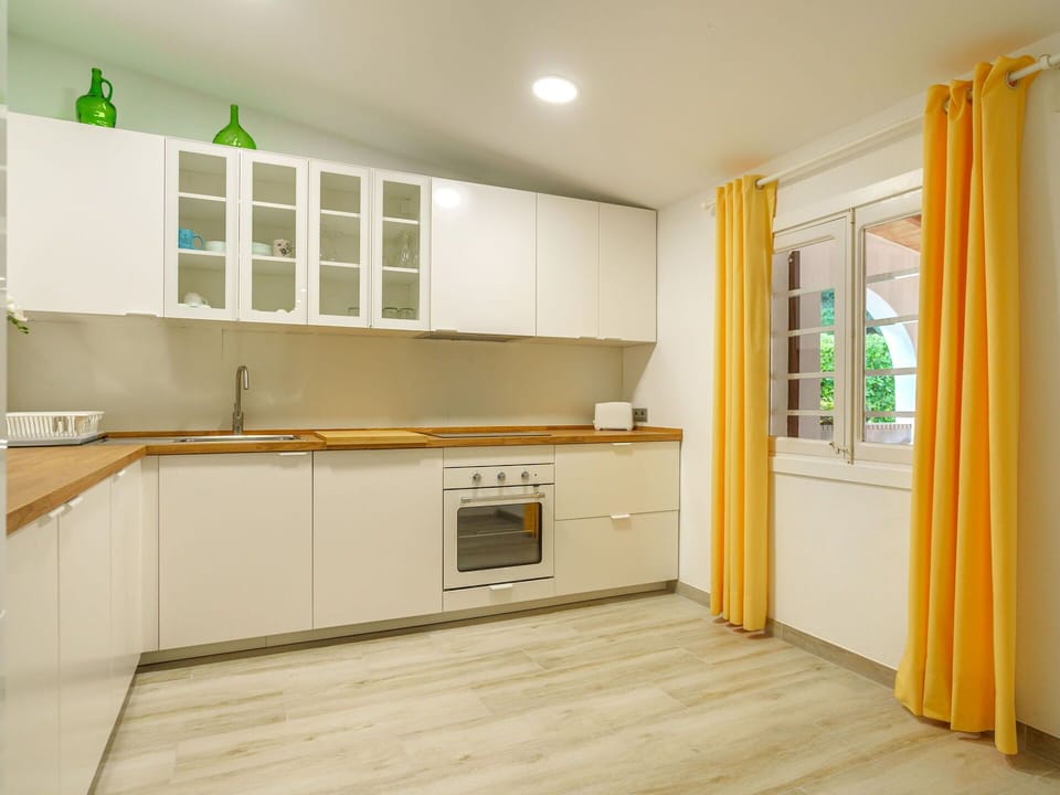 Cabinetry, Countertop, Building, Kitchen Stove, Window, Kitchen Appliance, Wood, Kitchen, Interior Design, Curtain