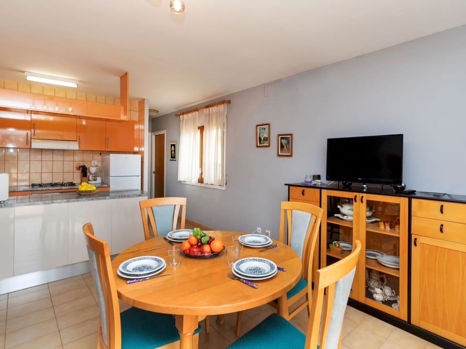 Furniture, Interior Design, Kitchen, Countertop, Kitchen & Dining Room Table, Room, Ceiling, Chair, Cabinetry, Wood Stain