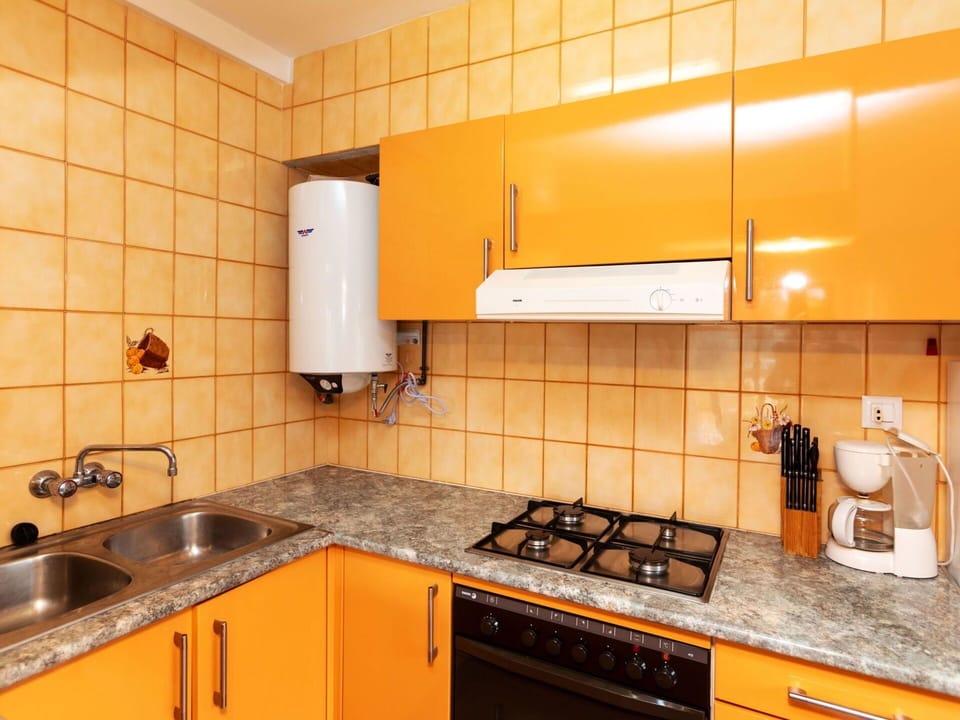 Countertop, Cabinetry, Property, Kitchen Sink, Building, Furniture, Sink, Kitchen Appliance, Kitchen, Kitchen Stove