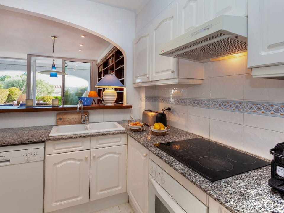 Countertop, Property, Room, Kitchen, Cabinetry, Furniture, Interior Design, Yellow, Real Estate, Building