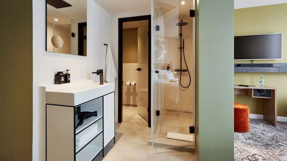 Shower, rainfall showerhead, designer toiletries, hair dryer