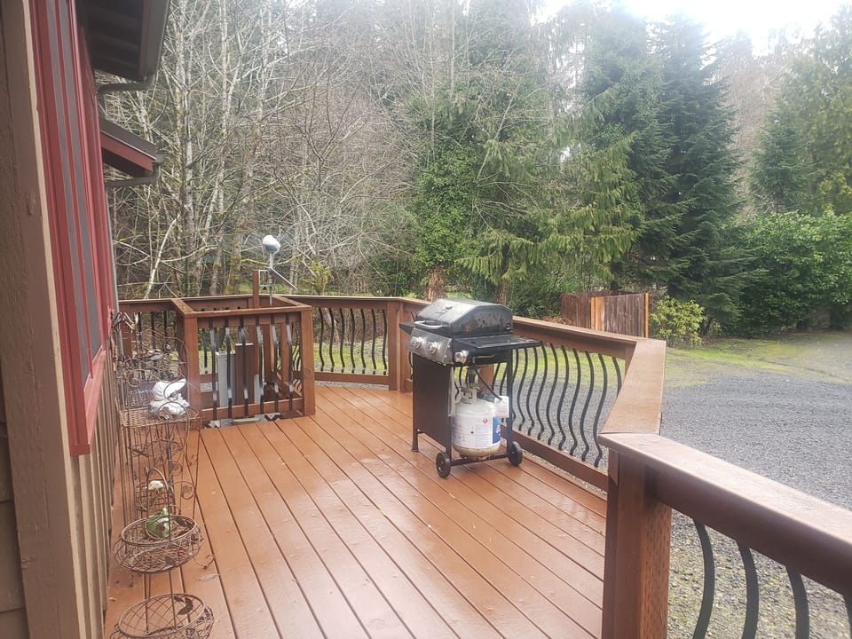 Spacious Deck with BBQ Grill. Deck is full length of the house