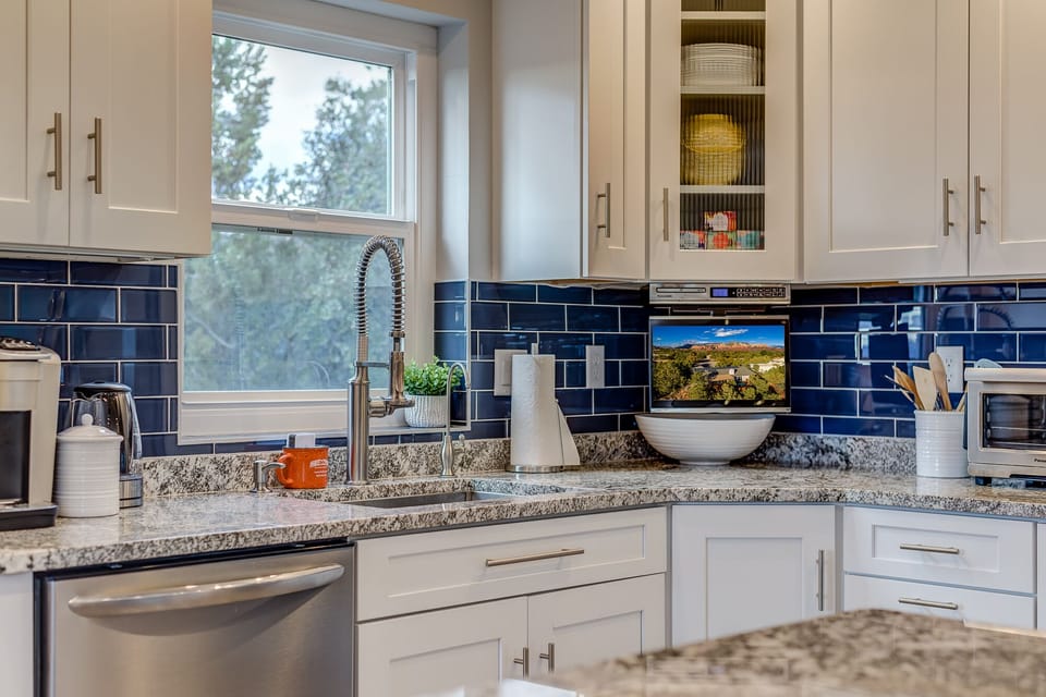 Remodeled Kitchen with Granite Counters and Shaker Cabinets
