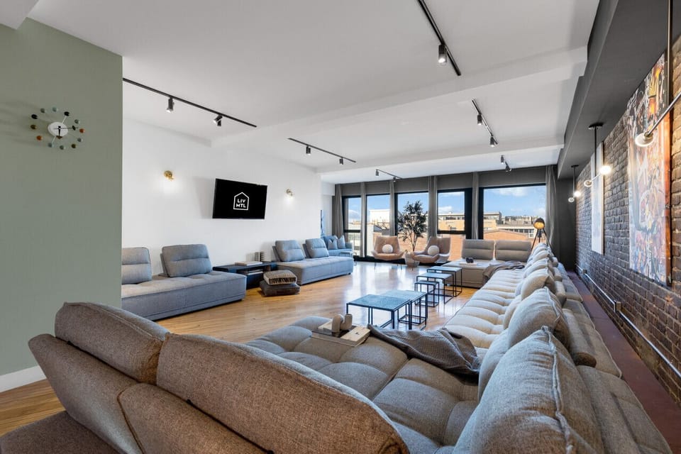 Living Room #1: Features 8 luxurious, brand-new full sofa beds, perfect for lounge group seating and providing ample sleeping space. Includes a Smart HD TV with Netflix, YouTube, and Prime Video.