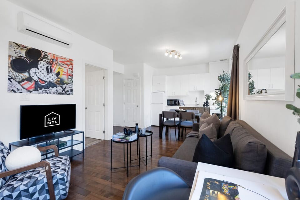 Living Room: Features 1 sofa bed, 1 queen-size bed with memory foam, Smart HD TV with Netflix, YouTube, and Prime.