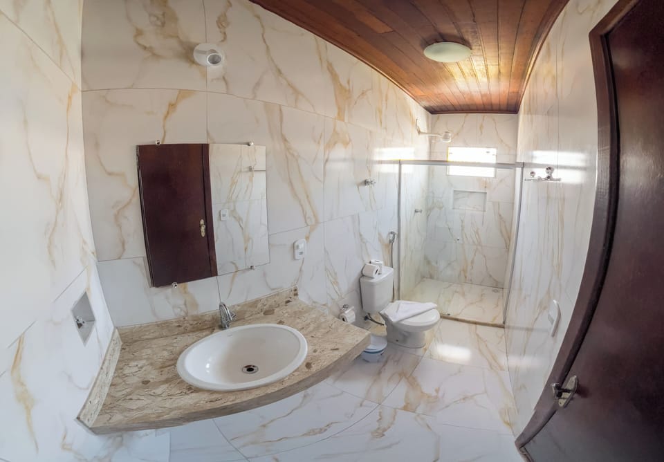 Standard Room | Bathroom | Shower, hair dryer, towels
