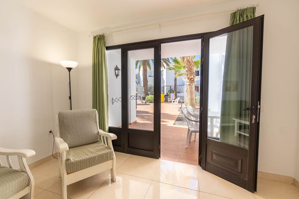 Apartment, 2 Bedrooms | Living room | Flat-screen TV