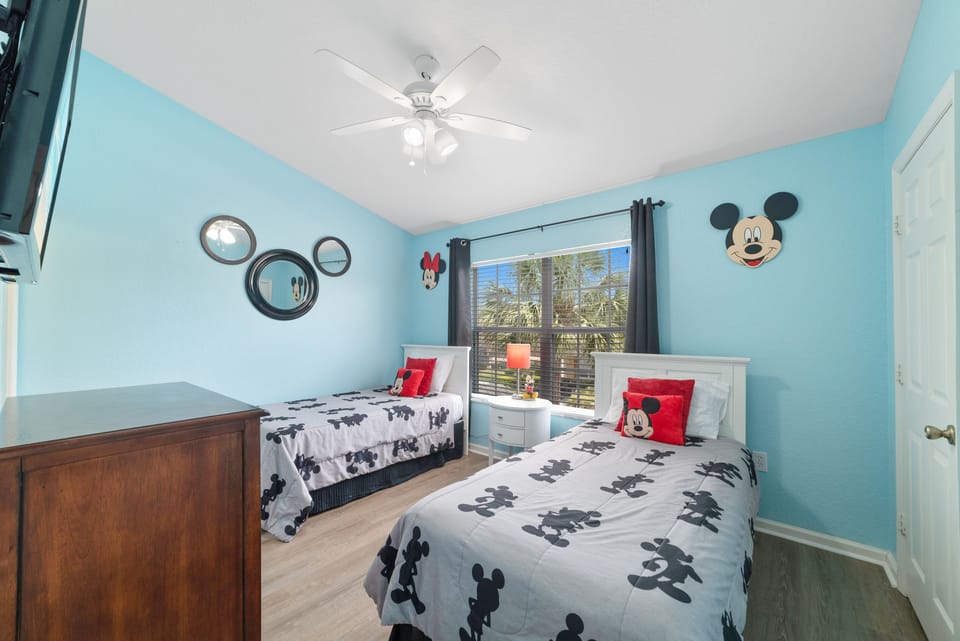 Disney themed bedroom for the young travelers. These are twin size beds. 