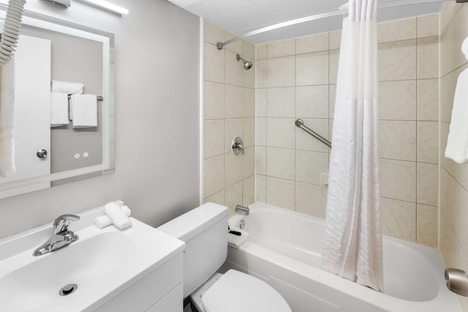 Room, 2 Double Beds | Bathroom | Combined shower/tub, rainfall showerhead, free toiletries, hair dryer