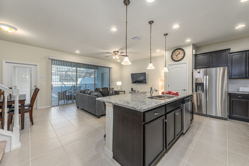 View 2 of beautiful modern style kitchen leading to living room area