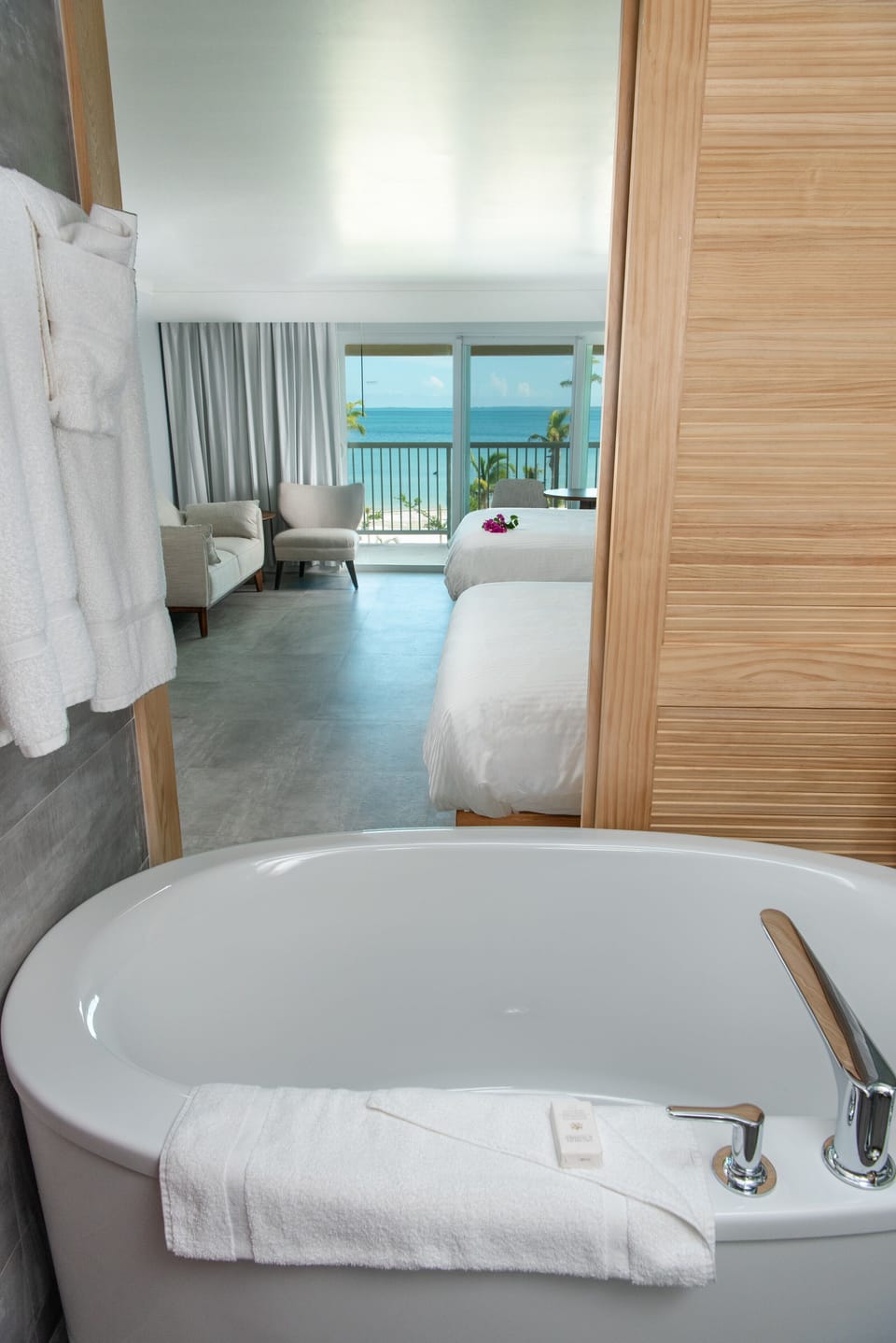 Deluxe Room, 2 Queen Beds (Plus) | Bathroom | Combined shower/tub, free toiletries, hair dryer, towels