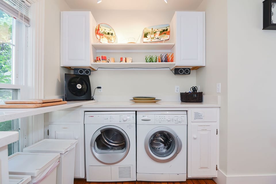 The laundry machines are also in the kitchen.