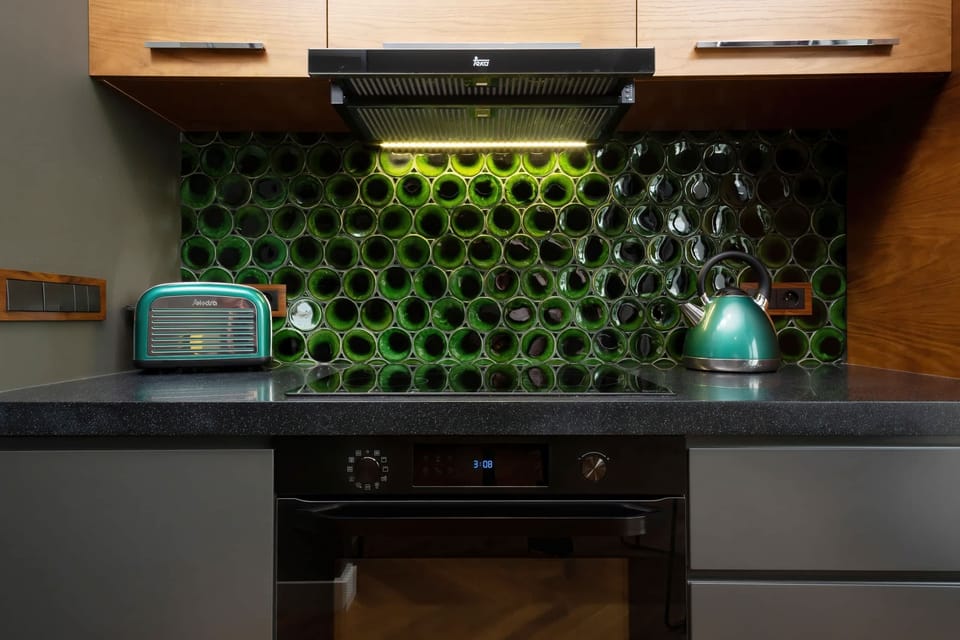 Kitchenette with oven and refrigerator. 
