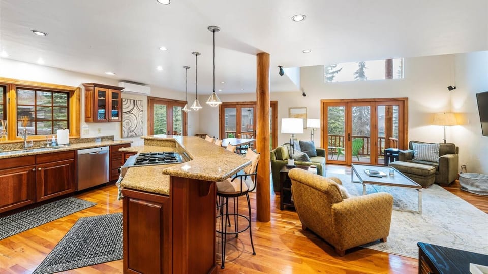 Fully stocked open concept kitchen with breakfast bar seating for 4, two ovens, gas stove, brand new appliances, drip pot coffee maker, and pantry.