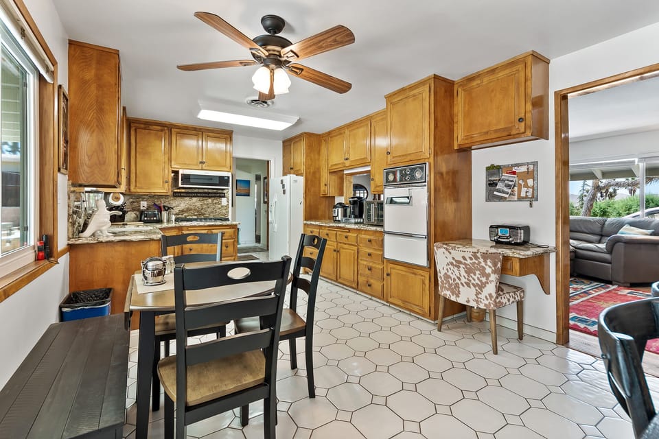 Kitchen fully stocked with convection oven, pots and pans, blender & Coffee Bar.
