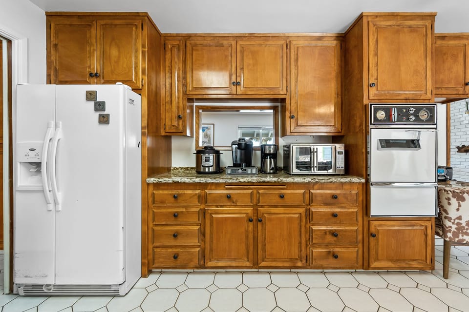 The kitchen is well stocked and there is a new refrigerator that is not shown. 