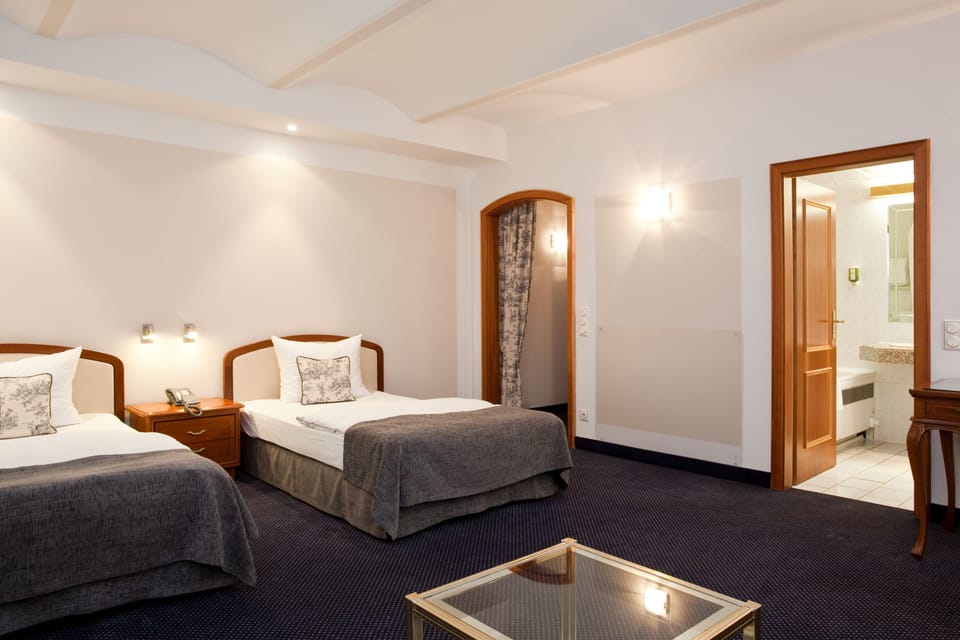 Hypo-allergenic bedding, pillowtop beds, desk, blackout drapes