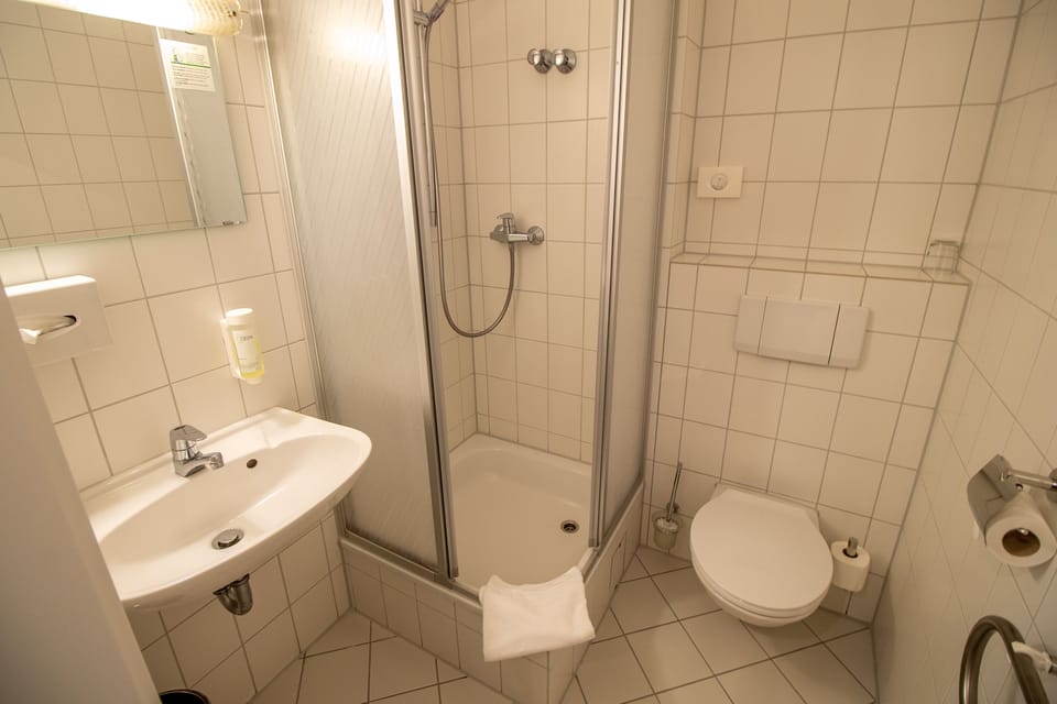 Standard Single Room | Bathroom | Shower, hair dryer, towels, soap
