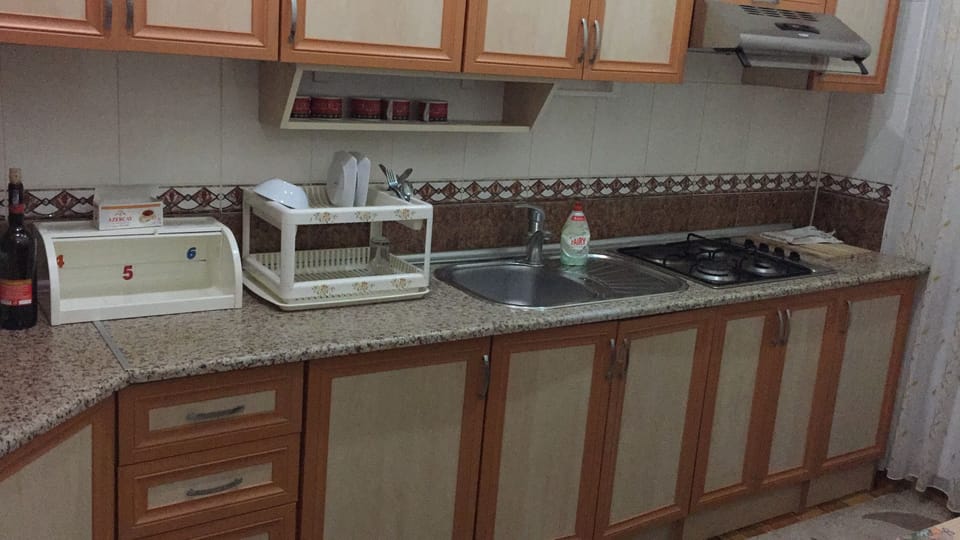 Coffee/tea maker, full-size fridge, shared microwave, oven