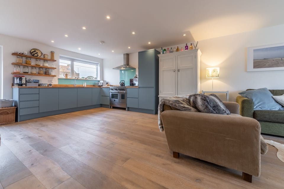 Well-equipped kitchen leading to sitting area