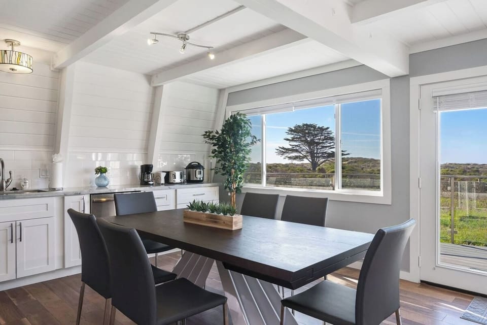 Spacious dining/kitchen area with an extendable table that can seat 8-12 guests in the 3-bedroom unit.