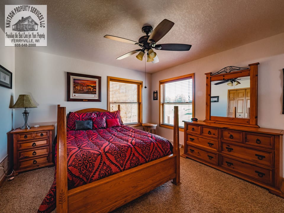 Master Bedroom on main level with queen bed and adjoining full bathroom