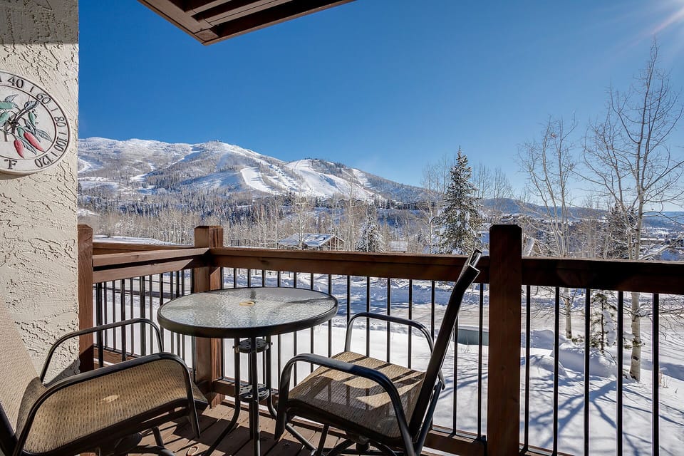 Sip your morning coffee on your private balcony while taking in breathtaking mountain views across pristine snow-covered slopes and forests.