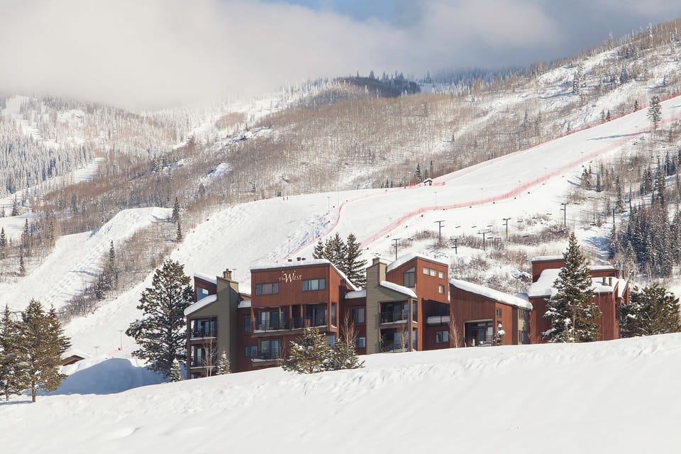 Modern mountain lodges nestled at the base of pristine ski slopes, offering convenient ski-in access and stunning alpine vistas.