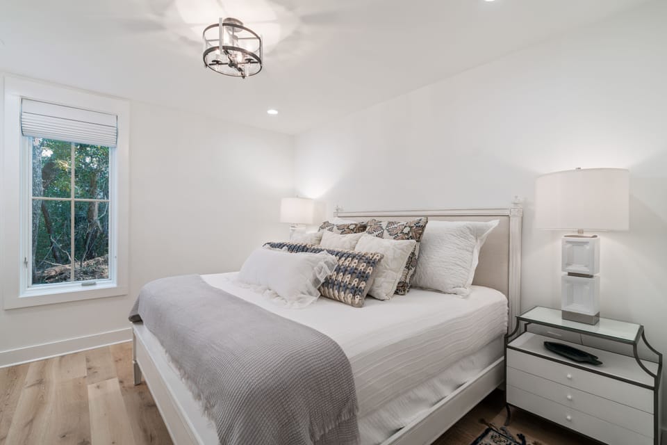 True Master Suite with King Sized Bed along lower level