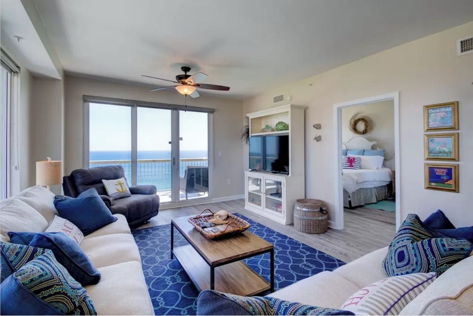 Unwind in your bright coastal living room with ocean views and cozy seating perfect for relaxing after beach days.