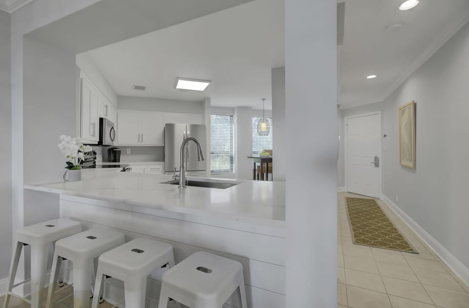 Kitchen with breakfast bar seating.