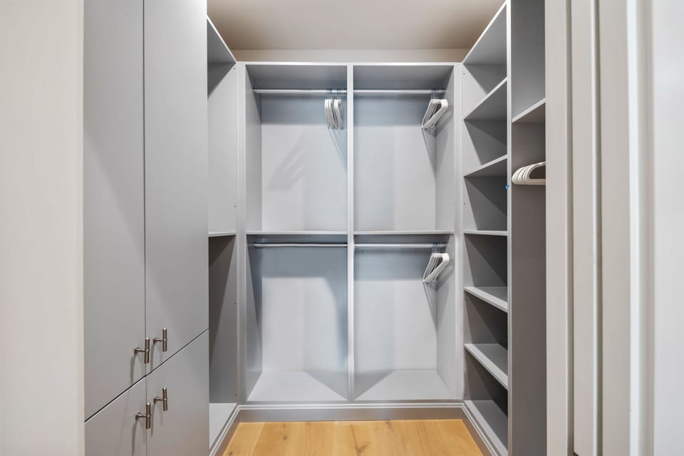 Spacious walk-in closet in primary suite.