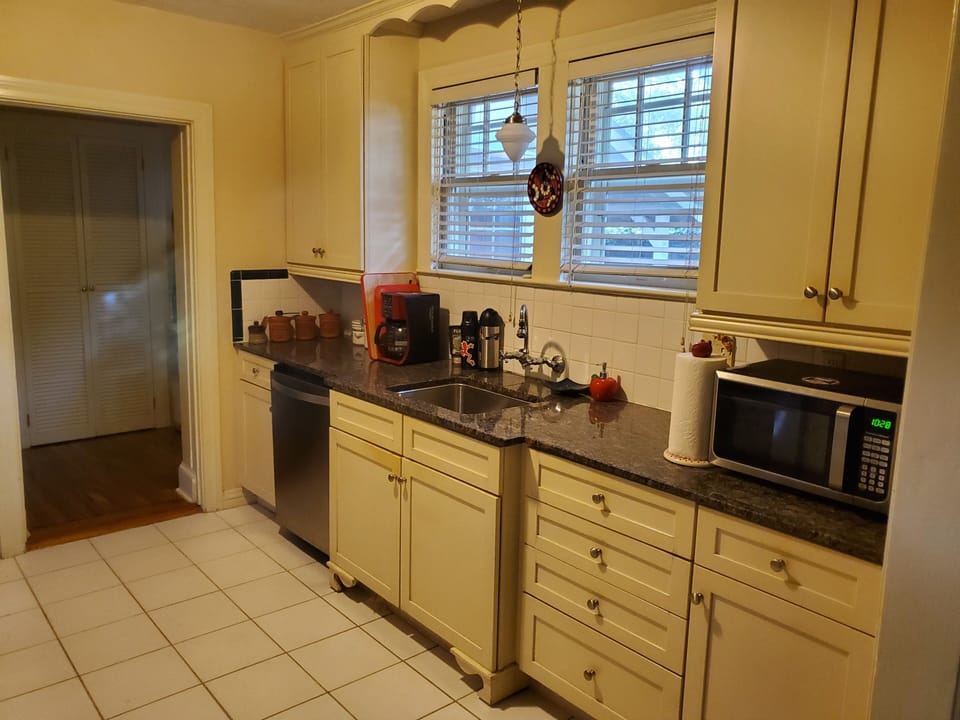 The Kitchen has a microwave, coffee maker, french press and coffee grinder too