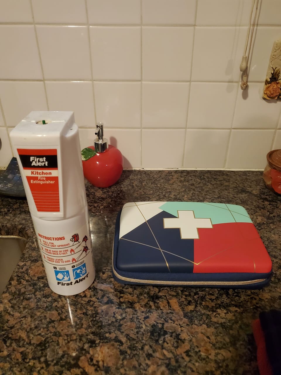 Extinguisher is under the kitchen sink. First aid kit is in the linen closet.