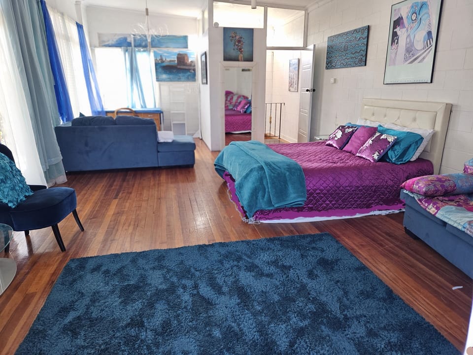 upstairs bedroom with outside verandah
