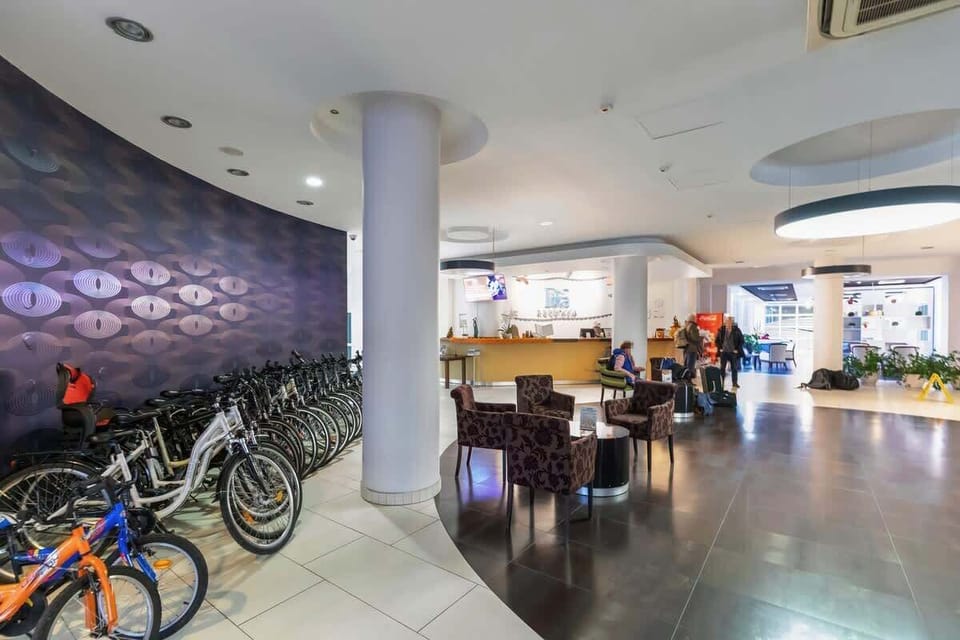 Hall with bikes and tables.