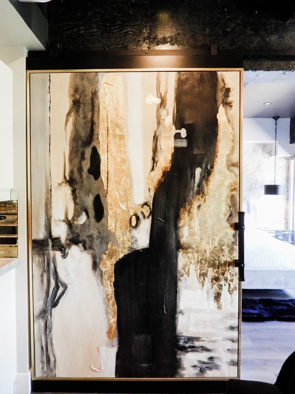 Industrial meets glam, with polished concrete beams throughout.