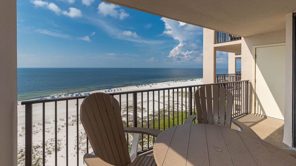 Sip your morning coffee while enjoying views of the shoreline and vibrant beach umbrellas