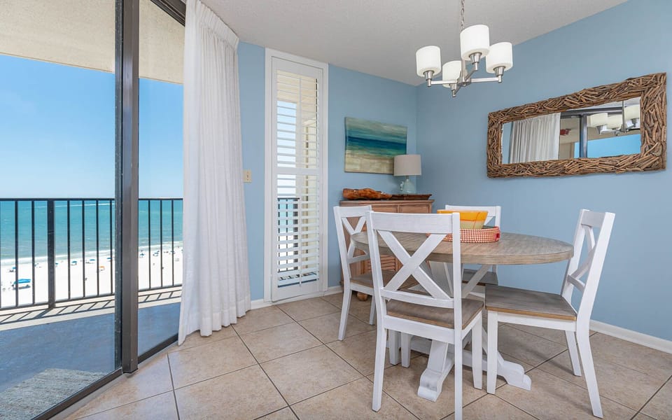 Enjoy meals at the round dining table while taking in the beautiful beachfront views