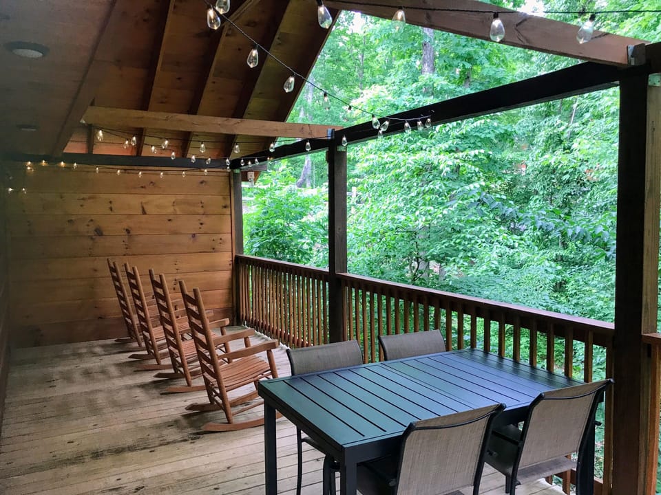 Upper deck with four rockers and table for four to relax. 
