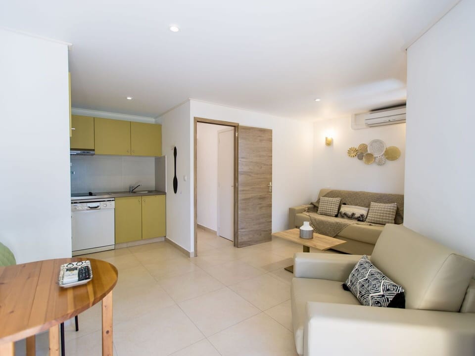 Table, Furniture, Cabinetry, Couch, Building, Picture Frame, Comfort, Wood, Flooring, Plant