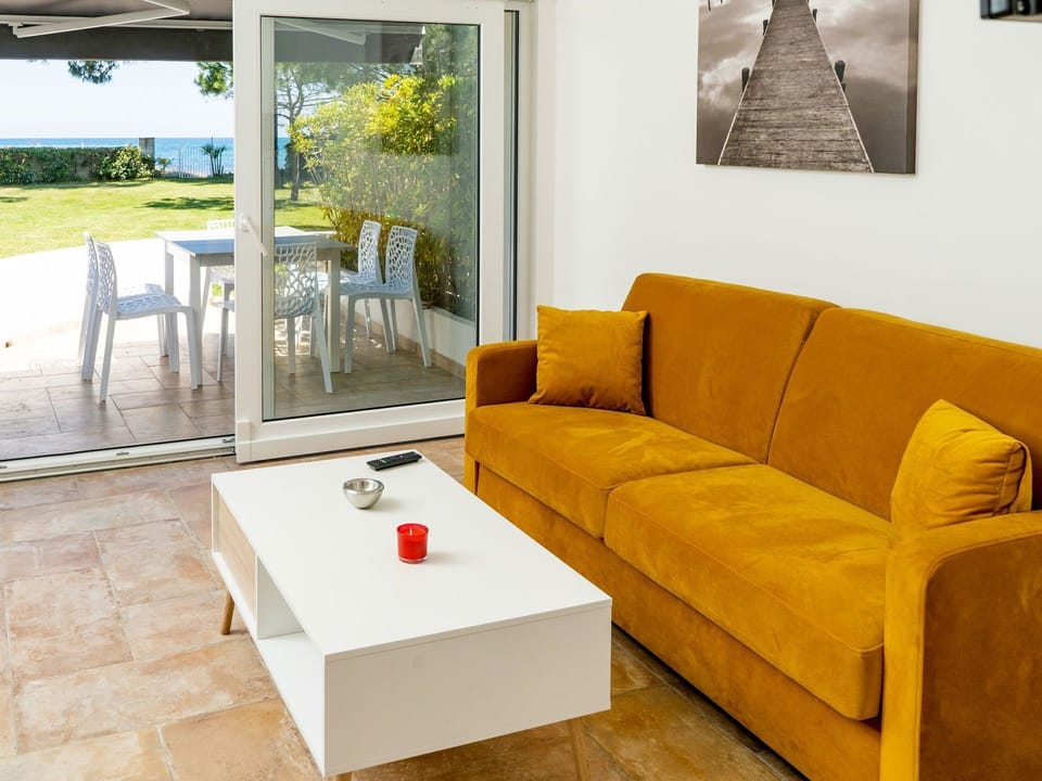 Furniture, Couch, Living Room, Room, Yellow, Floor, Property, Interior Design, Table, Sofa Bed