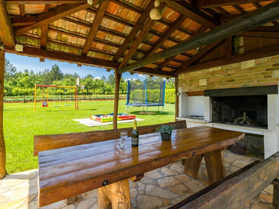 Property, Table, Plant, Wood, Tree, Building, Shade, Interior Design, Lighting, Architecture
