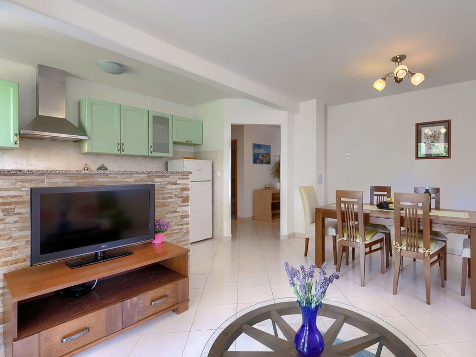 Furniture, Property, Table, Cabinetry, Wood, Living Room, Picture Frame, Flooring, Floor, Interior Design