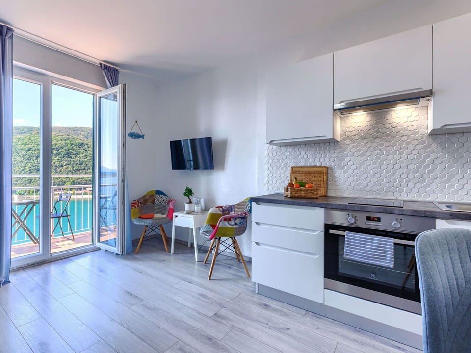 Furniture, Cabinetry, Wood, Countertop, Living Room, Kitchen Stove, Flooring, Floor, Kitchen Appliance, Kitchen