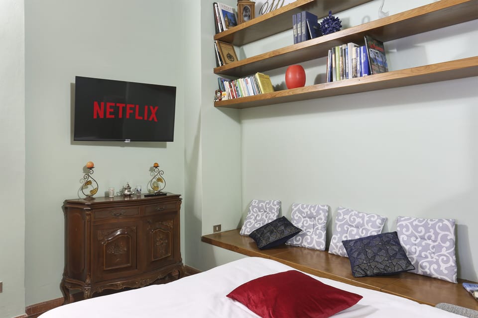 Classic Apartment, 1 Bedroom | Living area | 40-inch flat-screen TV with digital channels, Smart TV