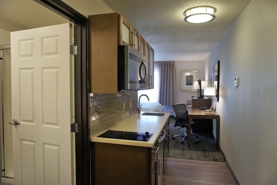 Studio Suite, 1 King Bed, Kitchen | Private kitchen | Coffee/tea maker, fridge, microwave, cookware/dishes/utensils