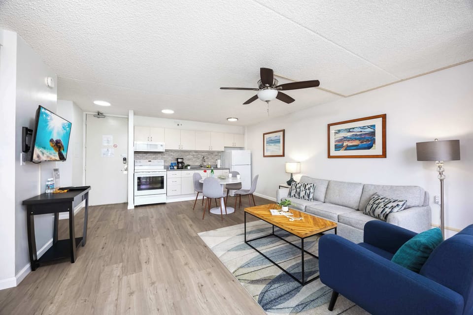 Experience the ultimate in open-concept living in your bright condo that seamlessly blends a modern kitchen, dining area, and cozy lounge.