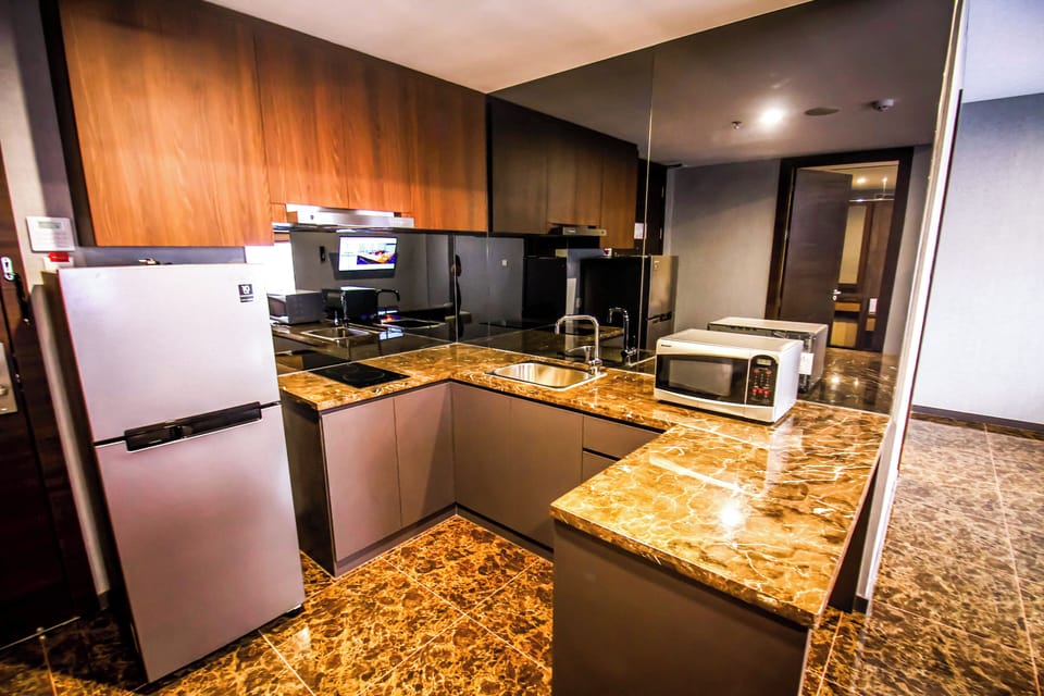 Exclusive Suite (Asialink Suite) | Living area | Flat-screen TV