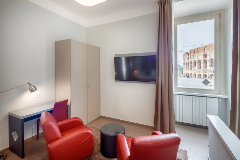 Suite (with Coliseum View) | Premium bedding, down comforters, minibar, in-room safe